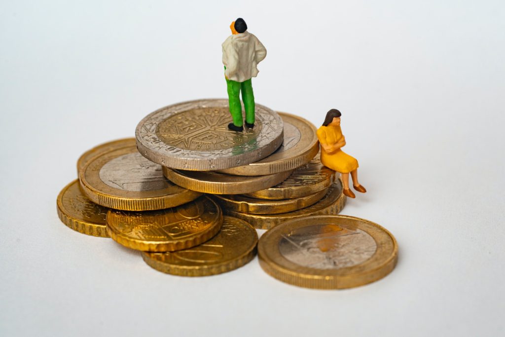 man and woman sitting on coins

scarcity